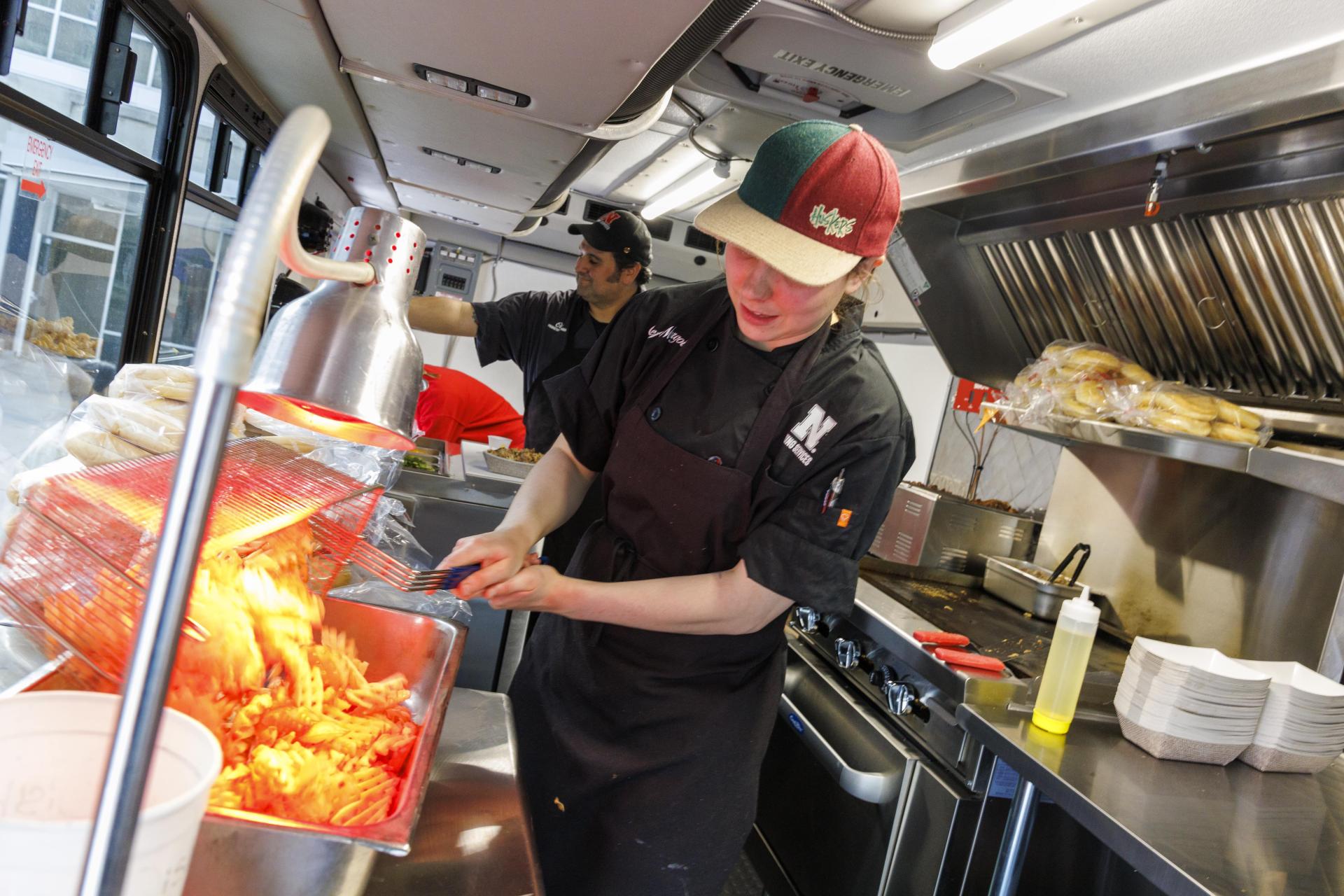 Harper Smokehouse Food Truck staff prepare dishes to be served