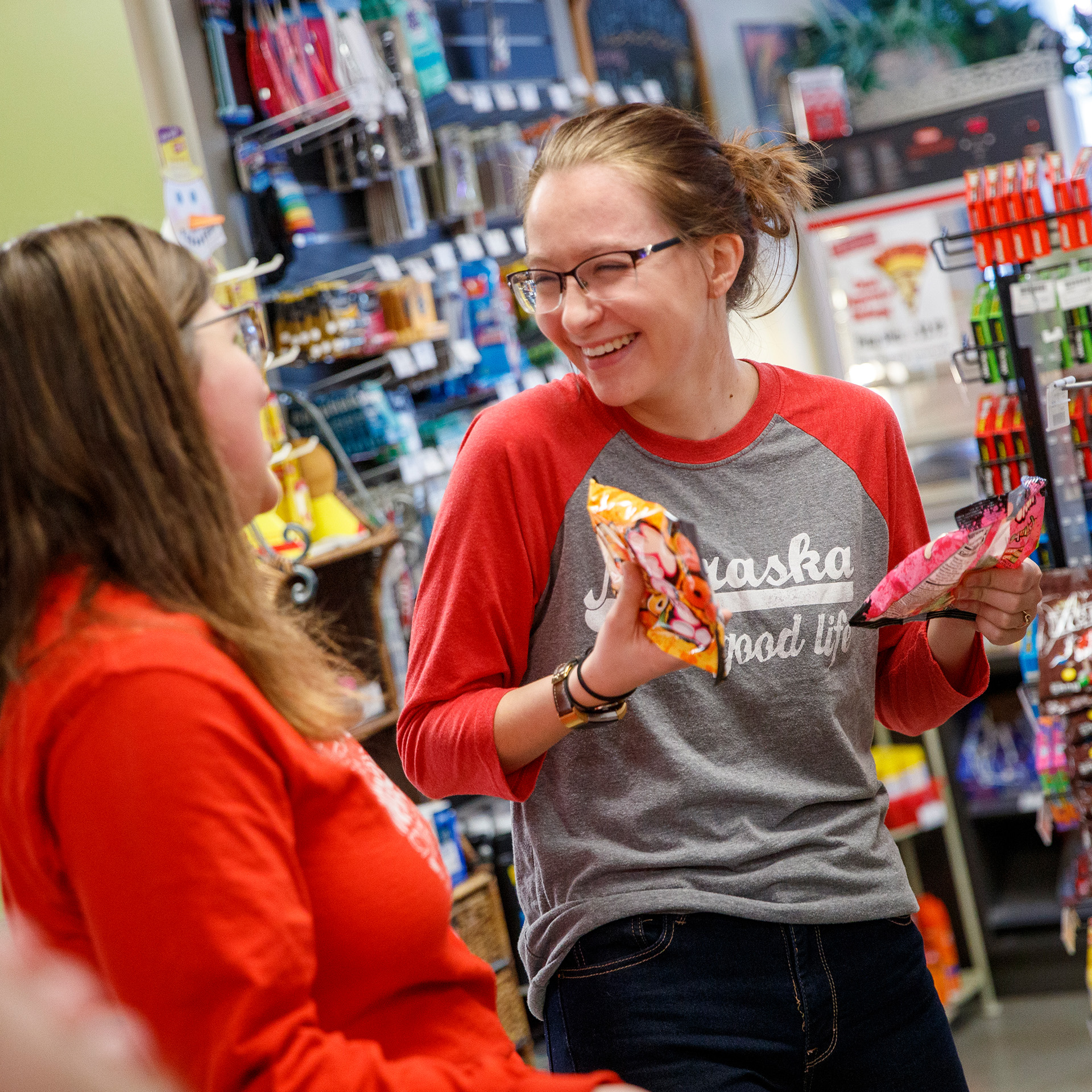 Students discuss snack options in the Herbie's Market at Village location