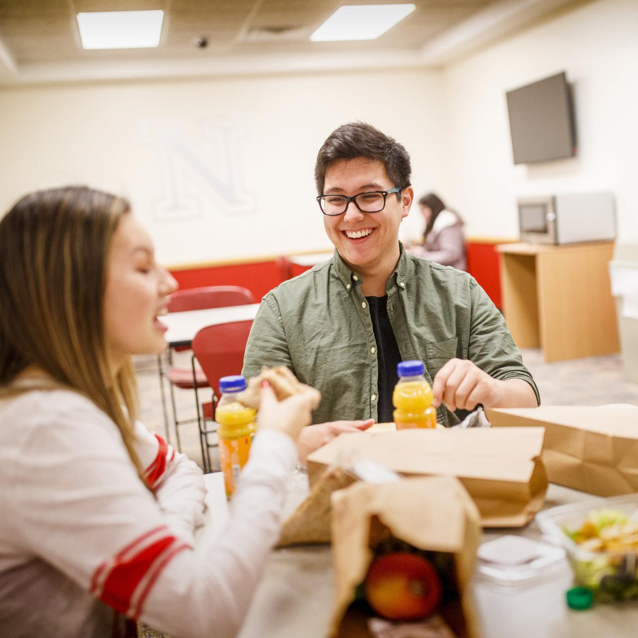Student dine on to-go options in the basement of Selleck