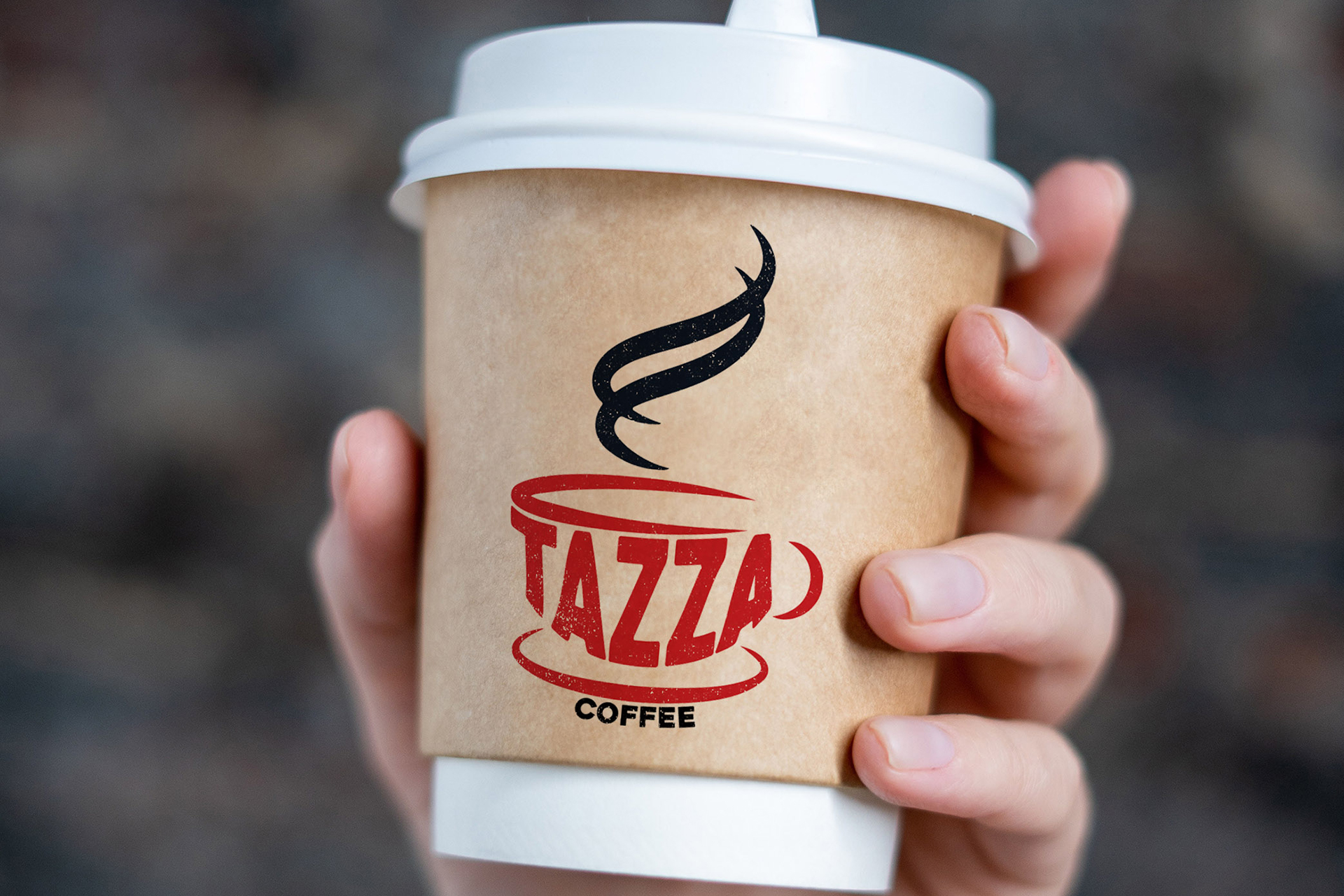 Hand holding a disposable Tazza coffee cup