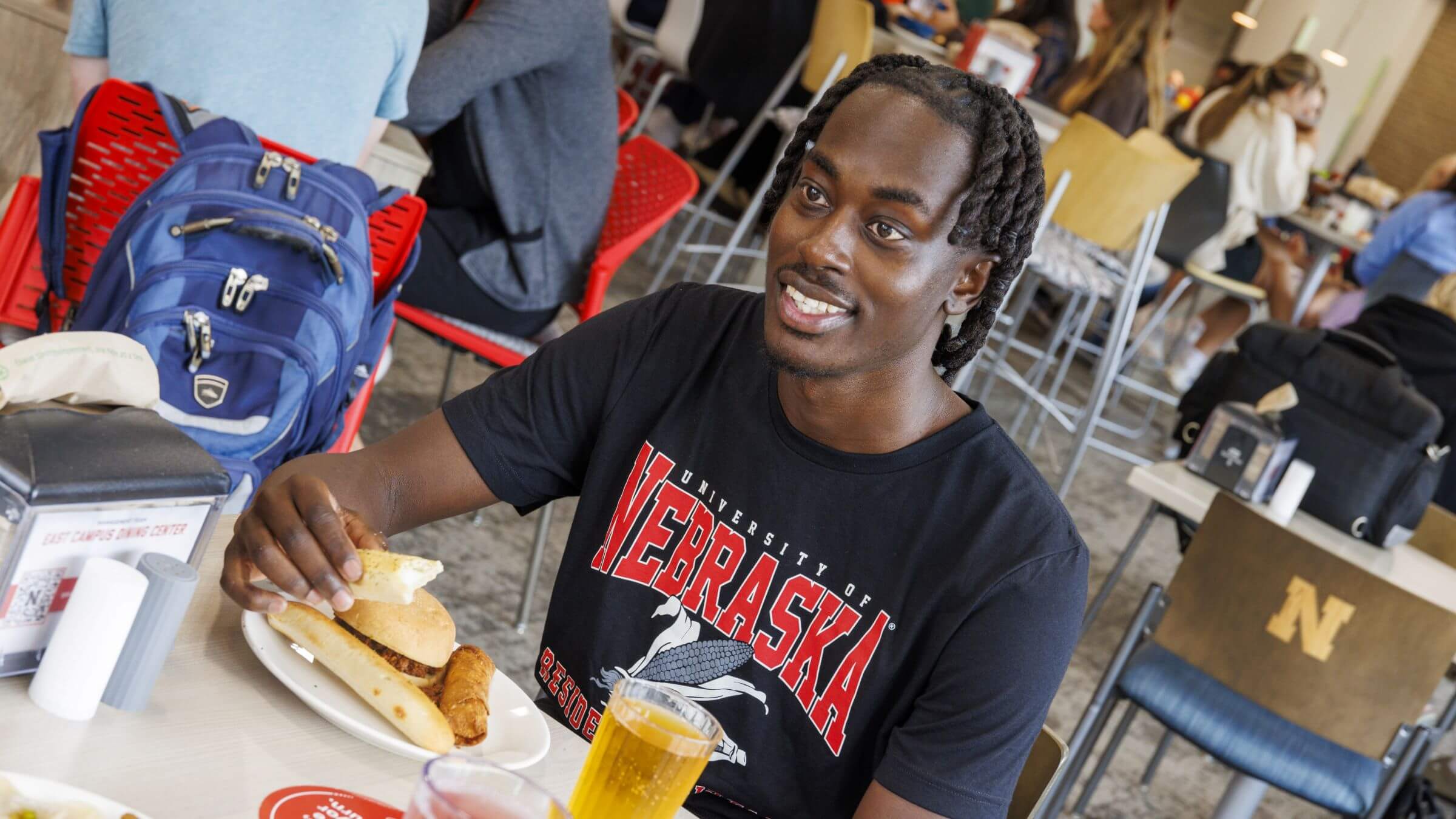 A student enjoying their meal in the East Campus Dining Center.