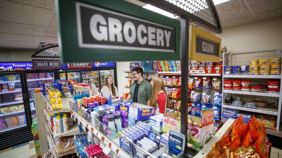 Students talk inside Herbie's Market at Selleck